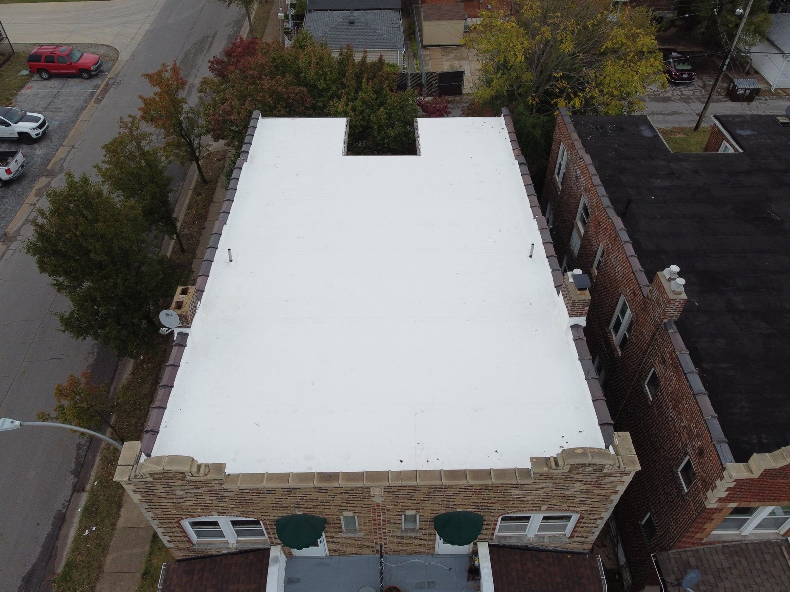 Meridian Roofing and Renovation team installing a TPO flat roof in St. Louis, MO.