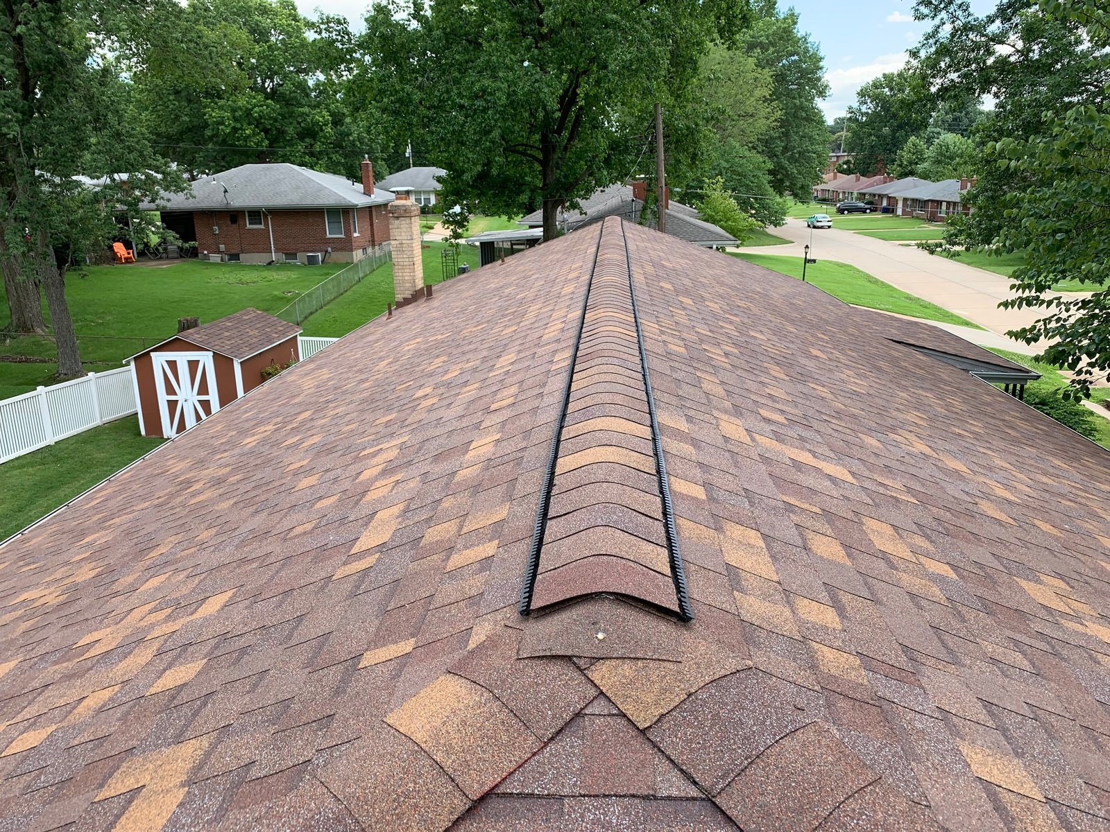 Meridian Roofing and Renovation team repairing a roof in St. Louis, MO.