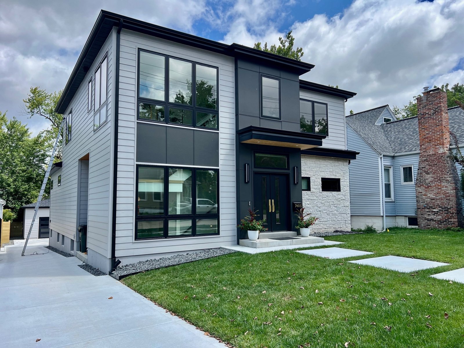 Meridian Roofing and Renovation team installing Hardie siding on a home in St. Louis, MO.