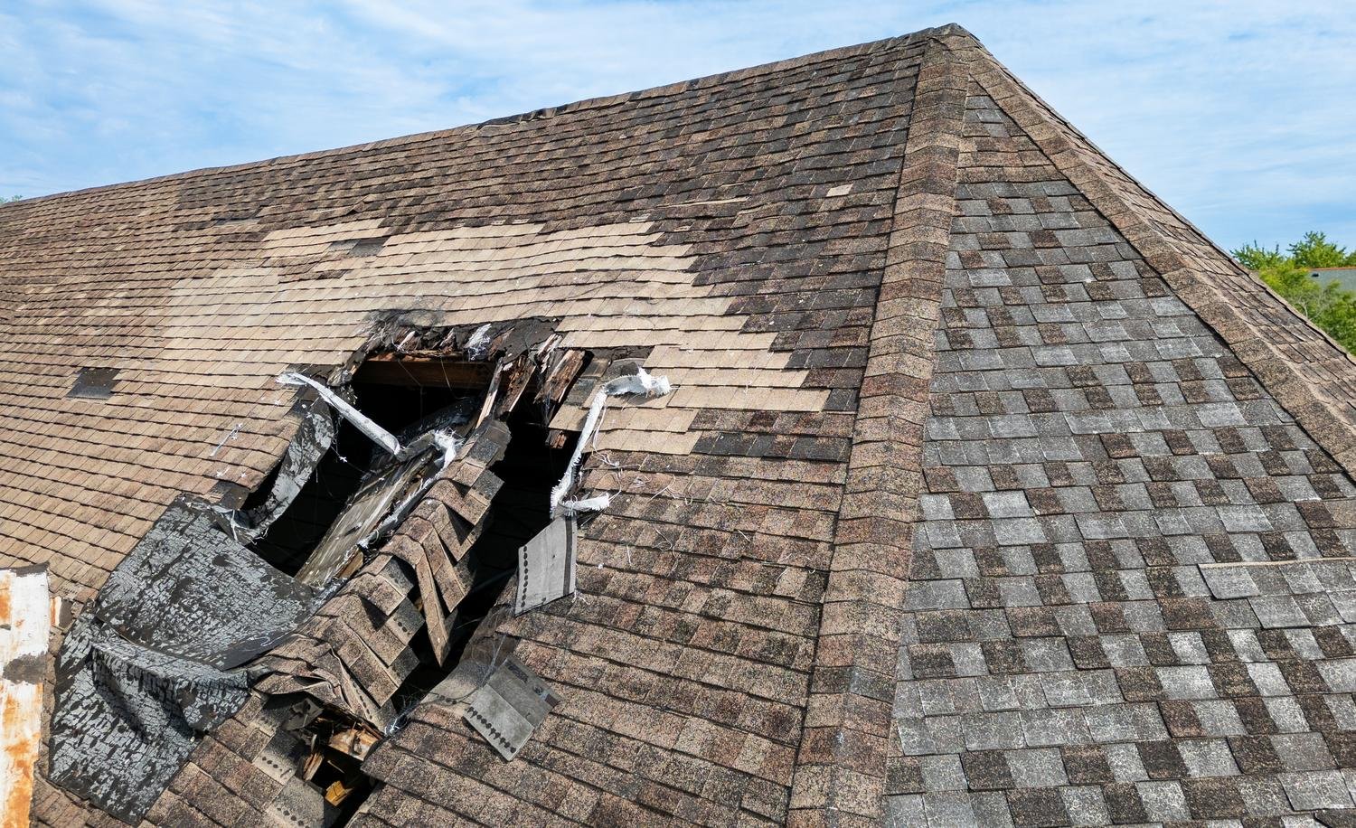 Storm-damaged shingles replaced by roof repair near me in St. Louis, MO