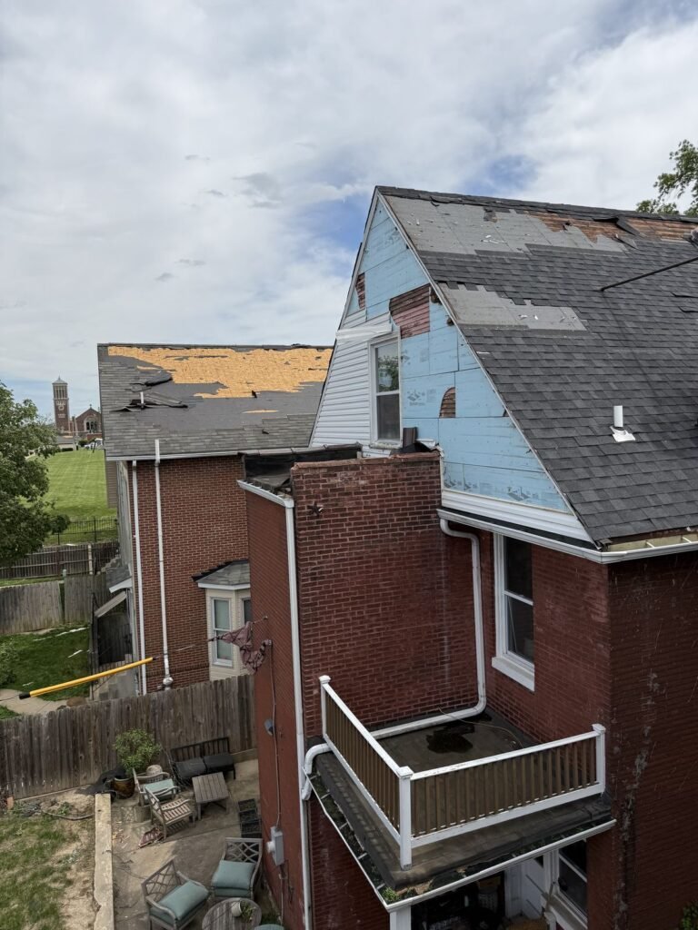 Residential roof with missing shingles found during Meridian Roofing inspection in St. Louis