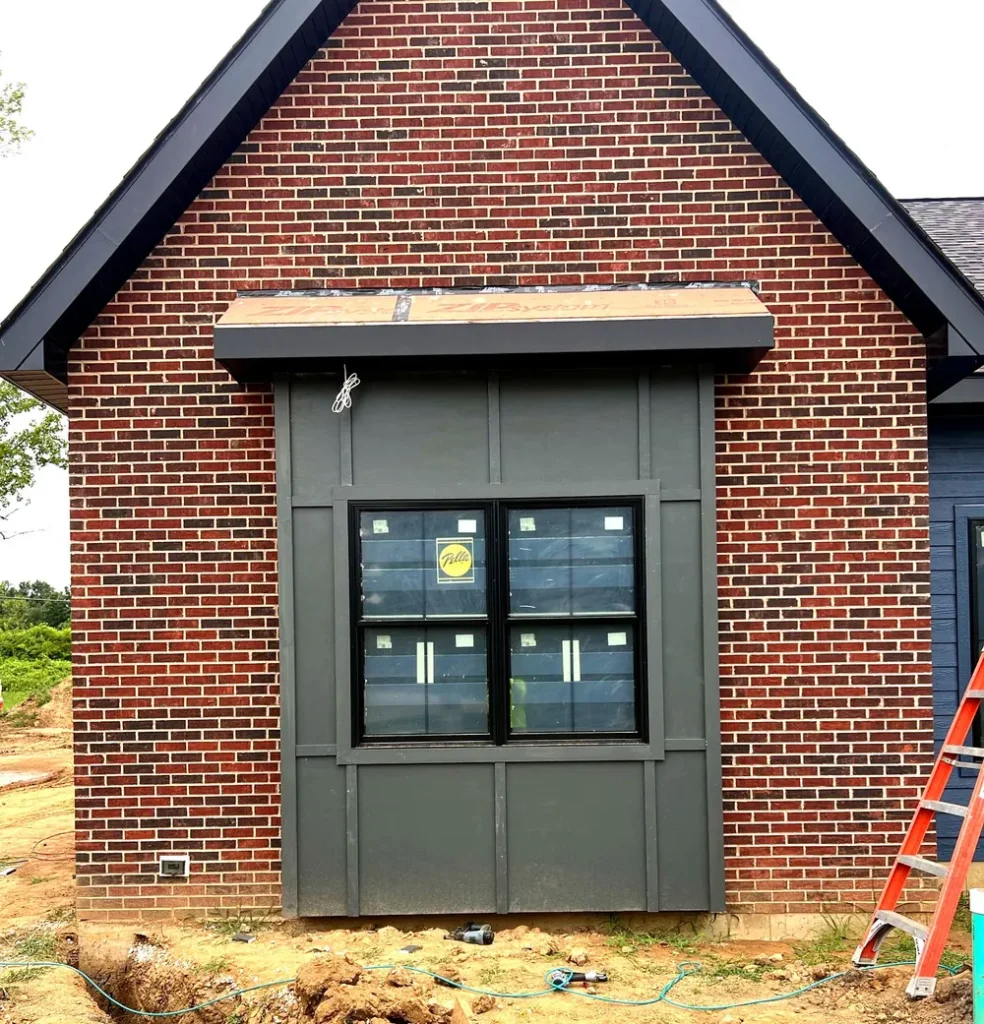 James Hardie panel siding accent on a red brick home in St. Louis City, MO