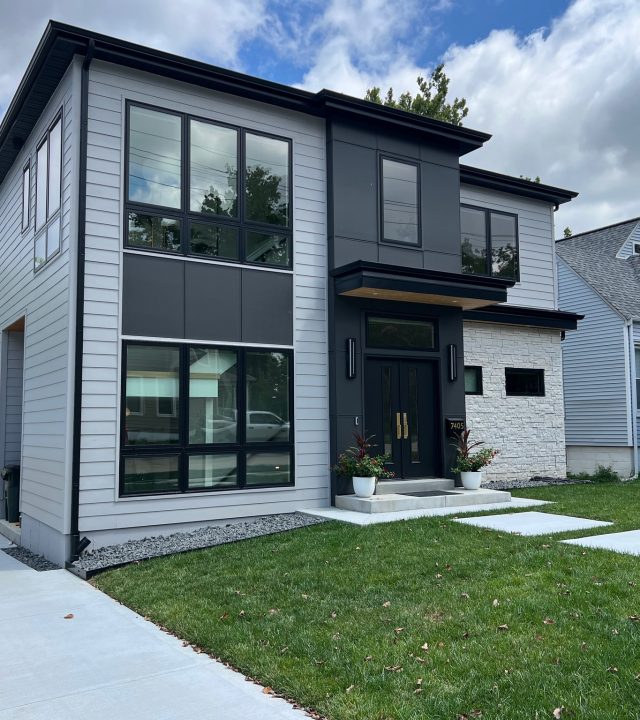 Meridian Roofing and Renovation team installing new siding in St. Louis, MO.