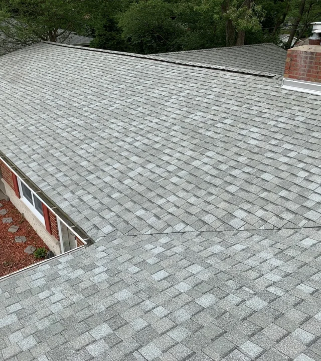 Asphalt shingles installed during roof replacement in Webster, MO Asphalt shingles installed during roof replacement in Webster, MO
