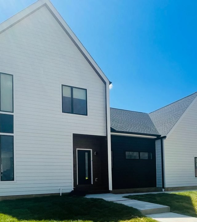 Meridian Roofing and Renovation team installing new siding in St. Louis, MO.