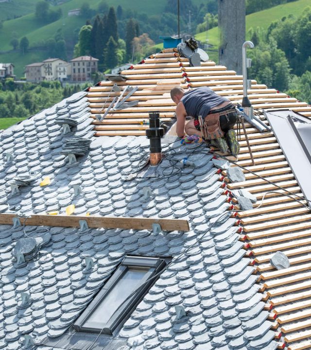 Crews at work during roof replacement near me in Creve Coeur, MO