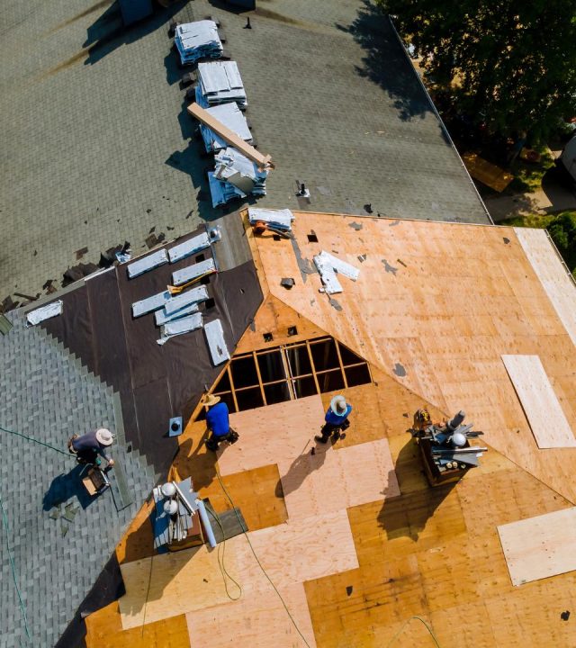 Crews replacing shingles by roof replacement in Richmond Heights, MO