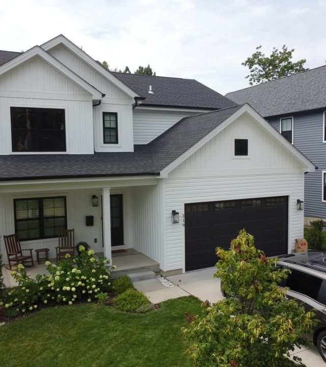 Meridian Roofing and Renovation team installing new siding in St. Louis, MO.