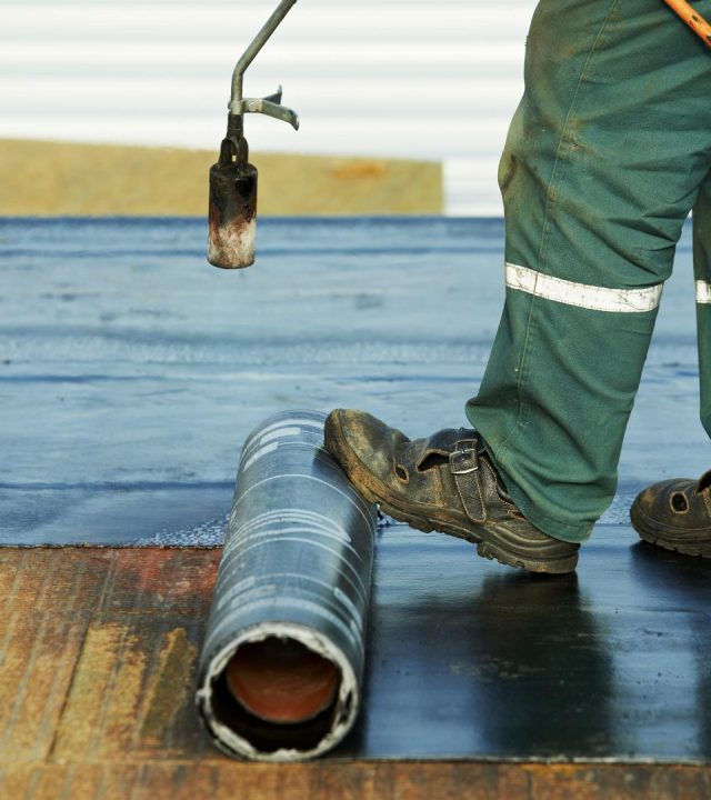 Expert installation underway by commercial roofing near me in Ladue, MO