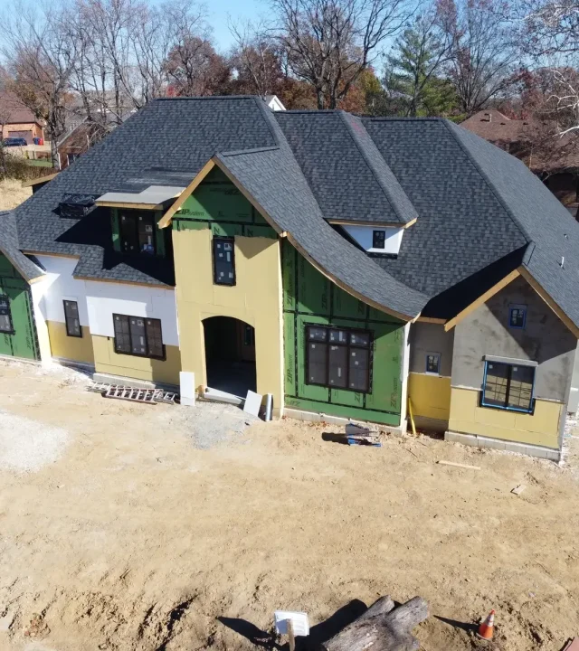 Expert team performing roof installation by roofing company in St. Charles County, MO