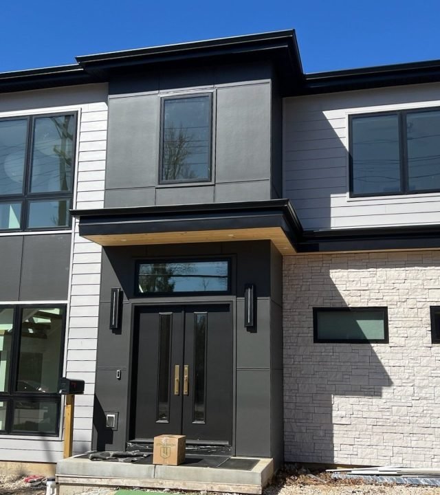 Meridian Roofing and Renovation team installing Hardie siding on a home in St. Louis, MO.