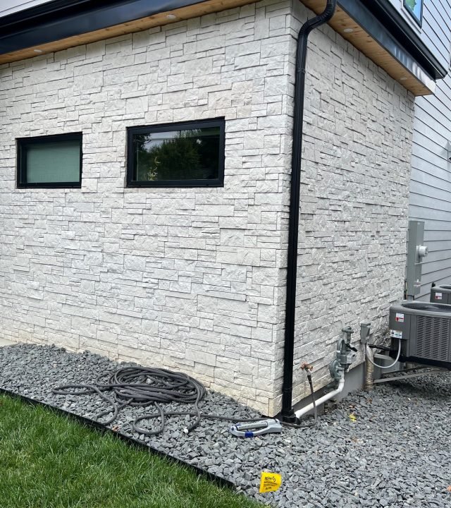 Meridian Roofing and Renovation team installing Hardie siding on a home in St. Louis, MO.