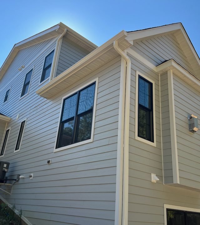 Meridian Roofing and Renovation team installing Hardie siding on a home in St. Louis, MO.