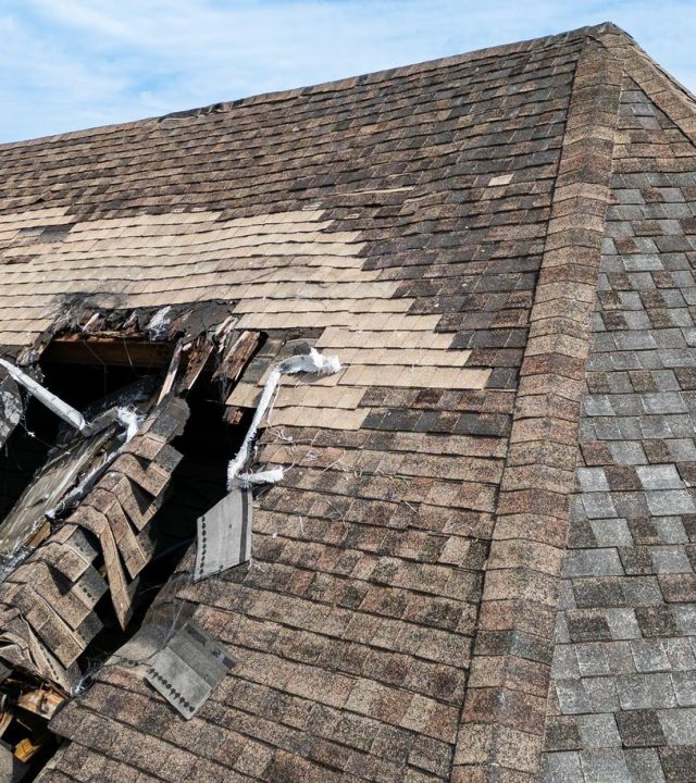 Specialist reviewing flashing during roof inspection near me in Des Peres, MO