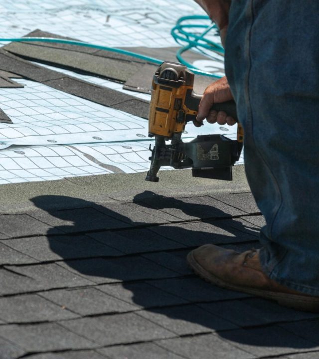 Team working on flat roof by commercial roofing near me in Des Peres, MO