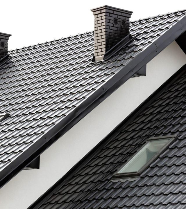 Technician performing roof inspection in Chesterfield, MO
