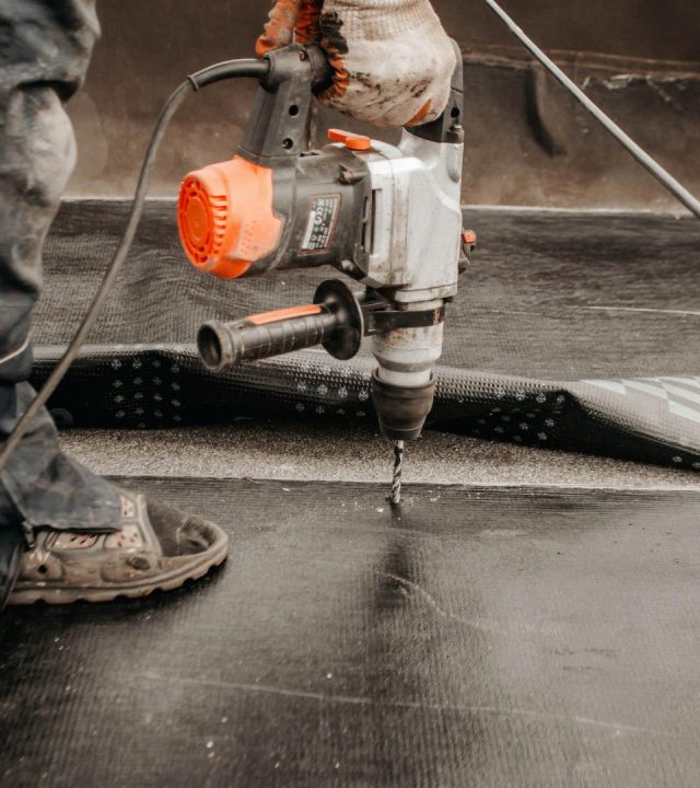 Technicians working on-site by commercial roofing near me in Sunset Hills, MO
