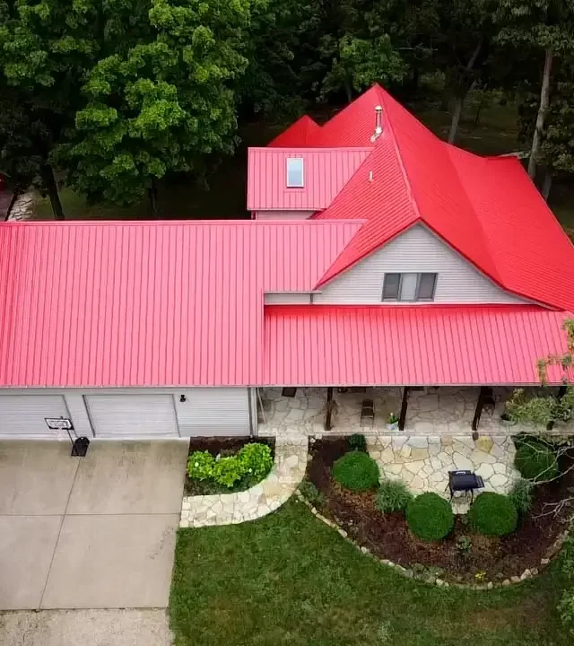 Working on the roof by a roofing company near me in St. Louis City, MO